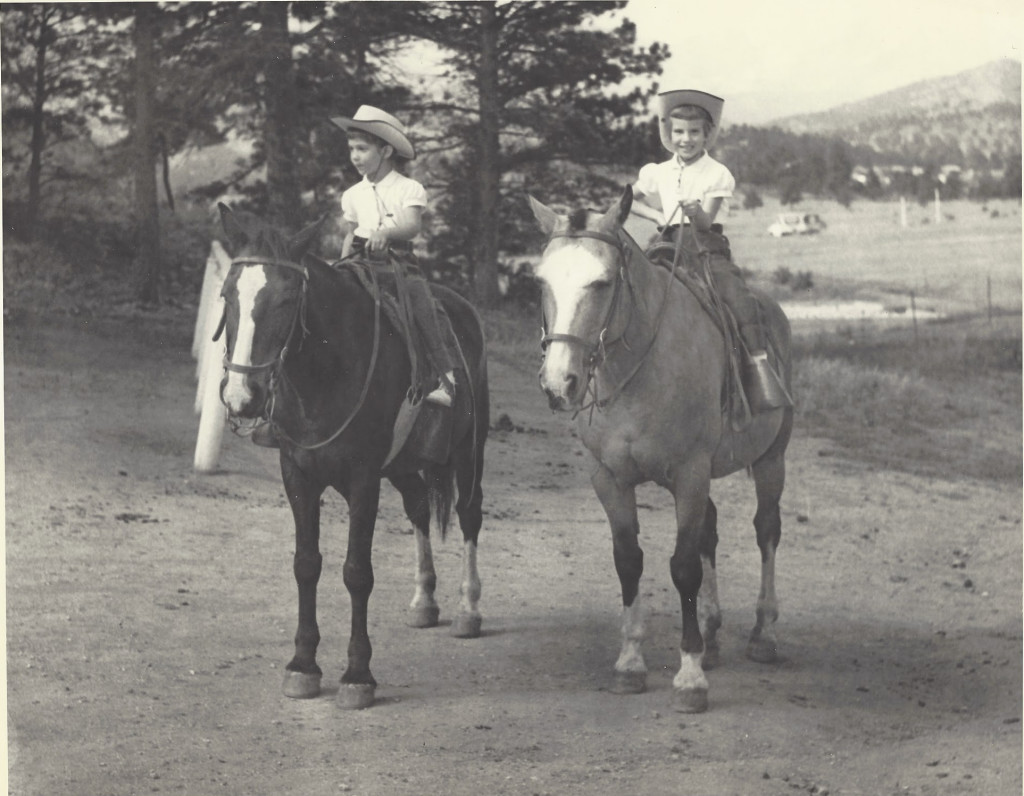 Dina and Vivienne riding horseback as children